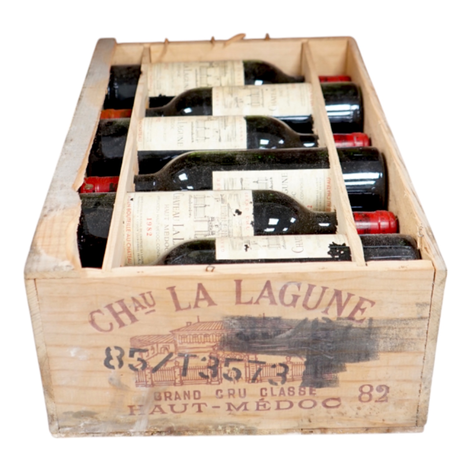 A case of twelve Chateau La Lagune, Haut-Medoc, 1982, France, OWC. Condition - fair, lacking cover. Storage history unknown